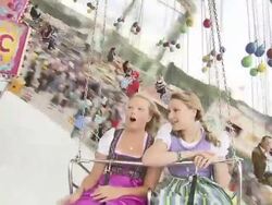 girls ride a carousel, in front Stock Footage