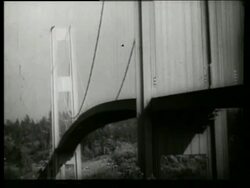 B/W 1940's bridge twisting, swaying + buckling in wind / Galloping Gertie / Tacoma Narrows Bridge / Stock Footage