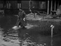 WAR AMID FLOODS - News Clip