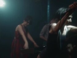 SLO MO band performing on stage of crowded nightclub, lead singer crowd surfs / New York, New York Stock Footage