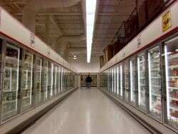 MS Shot of supermarket deep frozen aisle with people / Minneapolis, Minnesota, United States Stock Footage