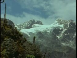 Zoom in to snow covered mountain top, Uganda, Africa Stock Footage