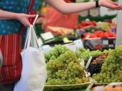 MS People buying grapes at market stall  Stock Footage