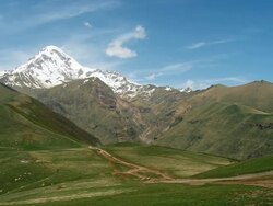 WS PAN View of Kazbegi mountain valley and snowy peaks of caucasus at morning / Stepantsminda, Kazbegi, Georgia Stock Footage