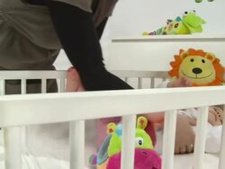 HD CRANE: Putting Baby To Bed Stock Footage