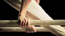 SLO MO Hands of male gymnast on the parallel bars Stock Footage