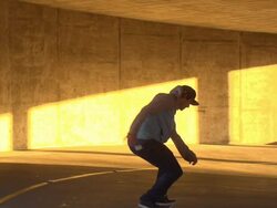 A young man skateboarding in a parking garage. - Slow Motion - filmed at 240 fps Stock Footage