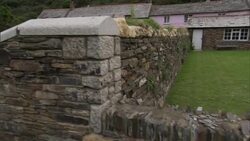 Stone walls enclose lush yards in Boscastle, England. Stock Footage