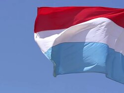 MS SLO MO Shot of Grand Duchy of Luxembourg Flag Waving in Wind / Caen, Normandy, France Stock Footage