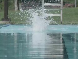 MS SLO MO Shot of Woman baby boomer in swim cap and colored swimsuit swimming butterfly stroke / Davis, California, United States  Stock Footage