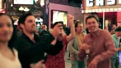 Friends dance at outdoor concert in downtown Las Vegas, take pictures with smartphones Stock Footage