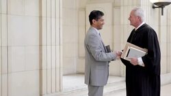 Lawyer and judge greeting at courthouse Stock Footage