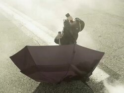 Boy on runway with binoculars and umbrella Stock Footage