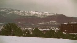 A blizzard rolls over a mountain and red cliffs. Stock Footage