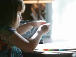 Little Girl Coloring a Picture Stock Footage