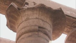 A decorative pillar supports a beam at ancient ruins in Karnak, Egypt. Stock Footage