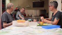 Family having lunch with disabled son Stock Footage