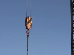 Crane lifting up something at lot Stock Footage