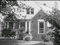 1951: 1950s FAMILY: DRAMATIZATION: HA WS Neighborhood houses. WS 'Norton' home. 'Mrs Norton' calling from bottom of stairs, 'Dinner's ready.'  Ham operator 'Chris Norton' turning off radio, leaving room. Instructional Video