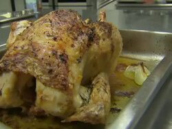 Roast chicken being carved to check it is cooked thoroughly News Clip