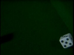 High speed, 2 dice roll across green baize, topshot Stock Footage