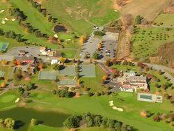 MS AERIAL View of State Park and Lakeland golf course at Quechee village / Vermont, United States Stock Footage