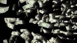 Dollar bills float in front of a black background. Stock Footage
