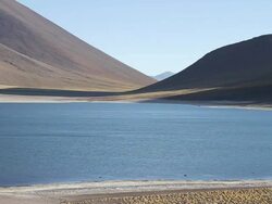 WS Multicolored landscape with blue lake and brown mountains / Laguna Miscanti, Atacama desert, Chile Stock Footage