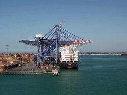 Shipyard cranes loading cargo Stock Footage