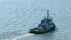 A tugboat moves through the Mississippi River. Stock Footage