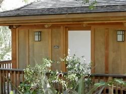 Tranquil yoga pagoda in wooded resort Stock Footage