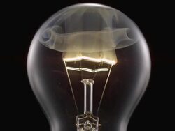 ECU SLO MO Shot of light bulb, showing burning and smoking tungsten wire / Munich, Bavaria, Germany Stock Footage