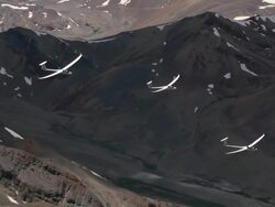 2010 AERIAL Gliders flying over rocky and snowcapped Andes mountains / Santiago de Chile, Gran Santiago, Chile Stock Footage