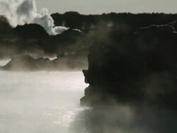 MS Steam blowing by volcanic rocks at hot spring / Haukadalur, Haukadalur, Iceland Stock Footage