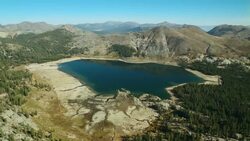 Upper Blue Lake lies at the base of The Nipple in the Mokelumne Wilderness, Eldorado National Forest, California. Stock Footage