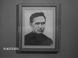1953: HAWAII: KALAUPAPA LEPROSY SETTLEMENT: Unidentified man walking into church yard, sign 'Damien Memorial Church 1872', MS Framed photograph of Father Damien, WS Grave w/ headstone &  Christian cross, CU Engraved headstone, WS Leper cemetery. Instructional Video