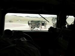 Soldiers in a Humvee looking out. Stock Footage