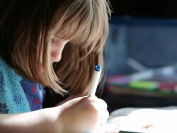 Little Girl Coloring a Picture Stock Footage
