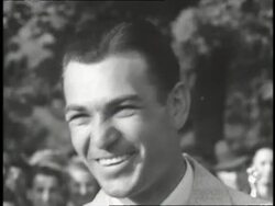 Golfer Ben Hogan smiles at the camera. News Clip