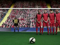 Footballer taking a free kick and scoring a goal Stock Footage