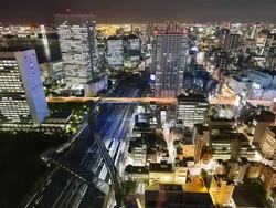 WS T/L View of elevated highway and train traffic in hamamatsucho at night / Tokyo, Japan Stock Footage