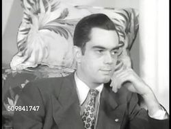 1946: LIVING WITH IN-LAWS: NIGHT: EXT house. DRAMATIZATION: INT Home living room w/ young couple & child, elder male talking about World War I, grandmother scolding child for tipping lamp, mother defending child, asking her not to speak to her that wa Instructional Video