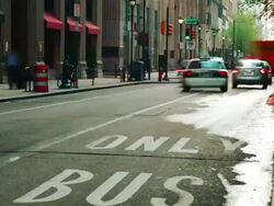 Time lapse, downtown street with buses, cars,  traffic, pedestrians, and buildings. Stock Footage