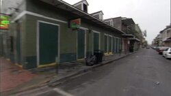 Cars line a narrow one-way street. Stock Footage