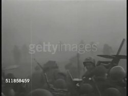 1944: PACIFIC THEATER: WS (BEHIND Soldiers) Allied soldiers in LAVP, landing & leaving landing craft on foggy beachfront. WS Soldiers coming down ramps of transport ship onto shore. (LST #607) Pacific Campaign, Pacific Front, WWII, World War II. Instructional Video