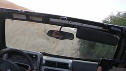 CLEAN : Far from Libyas chaos drivers battle it out in dunes News Clip