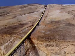 AERIAL WS  CU View of potash conveyor in desert / Sourn Judea Desert, Israel Stock Footage
