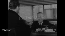 1936: U.S. PRESIDENTIAL CAMPAIGN FUNDING: INT MS Man writing check at dining table. INT MS Another man at desk handing check to man. INT MS Women typing on typewriter. CU Hands typing fast. MS Automatic typewriters typing. Propaganda, money Instructional Video