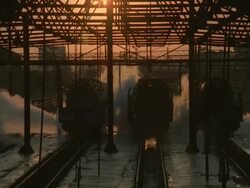 MS ZO ZI Shot of silhouetted man jumping off train on railway tracks / South Africa Stock Footage