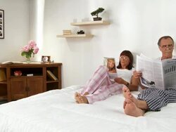 Couple Reading In Bed Stock Footage